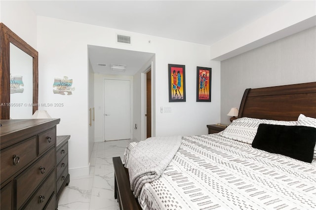 bedroom with marble finish floor and visible vents