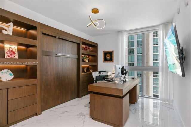 office space with marble finish floor