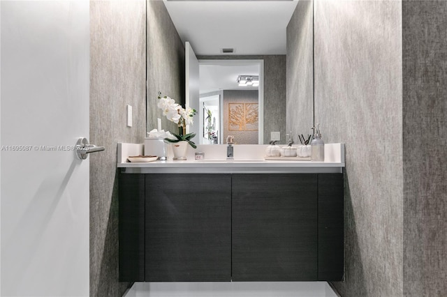 bathroom featuring vanity and visible vents