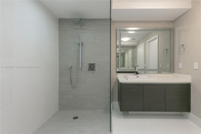 bathroom with vanity and a walk in shower