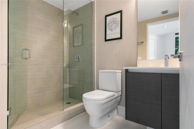 full bathroom featuring visible vents, toilet, a shower stall, and vanity