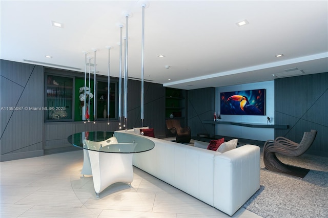 living area with visible vents and recessed lighting