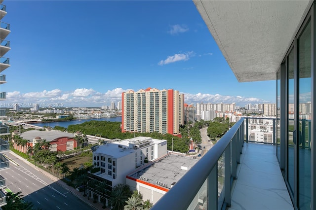 balcony with a water view and a city view