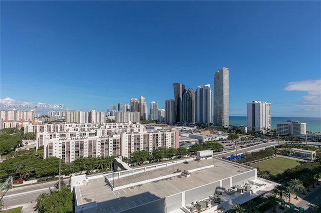 property's view of city featuring a water view