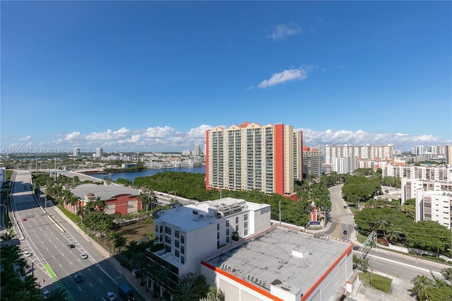 bird's eye view featuring a view of city and a water view