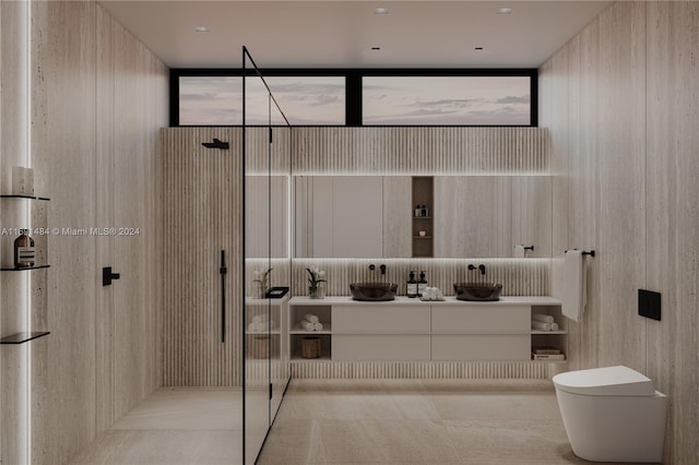 bathroom with toilet, vanity, and walk in shower