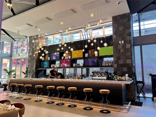 bar featuring a high ceiling