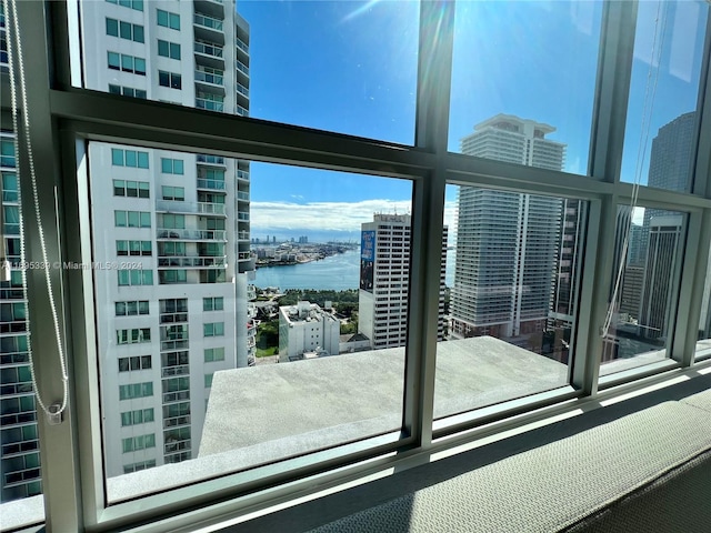 doorway to outside with a water view