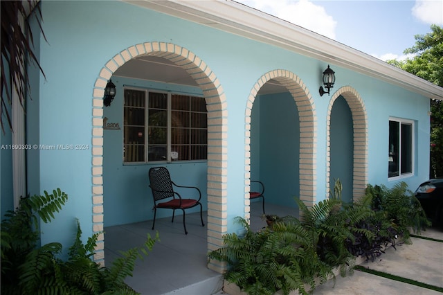 doorway to property featuring a patio area