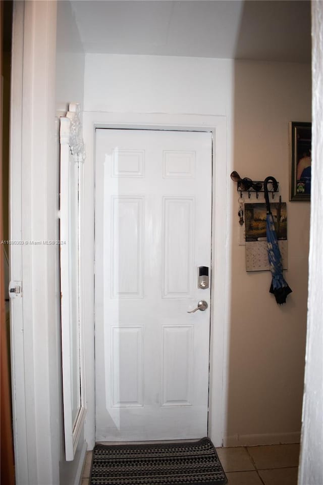 doorway featuring tile patterned floors