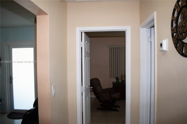 hall featuring tile patterned flooring