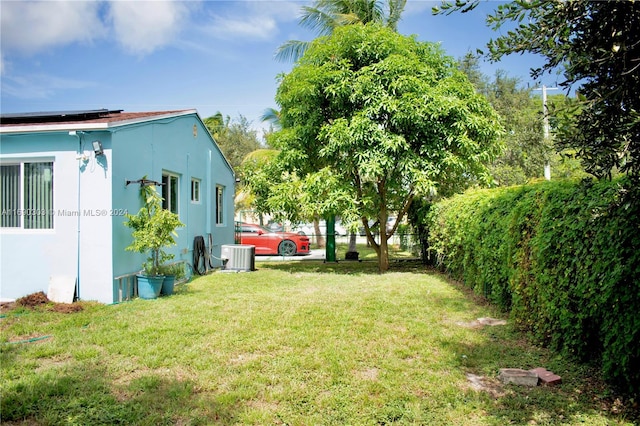 view of yard with central AC