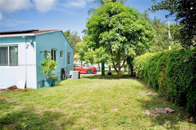 view of yard featuring central air condition unit