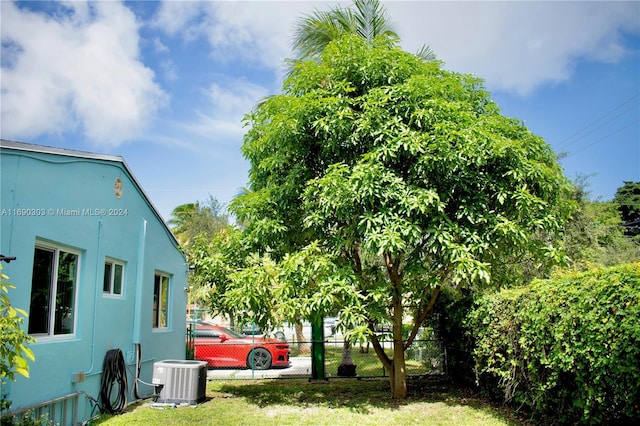 view of yard with central air condition unit