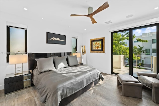 bedroom with access to exterior, ceiling fan, wood finished floors, and recessed lighting