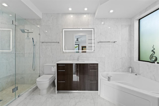 full bath featuring a garden tub, tile walls, a marble finish shower, and vanity