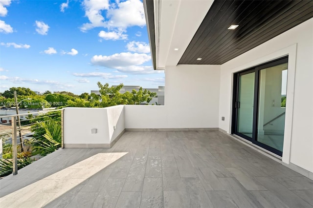 view of patio featuring a balcony