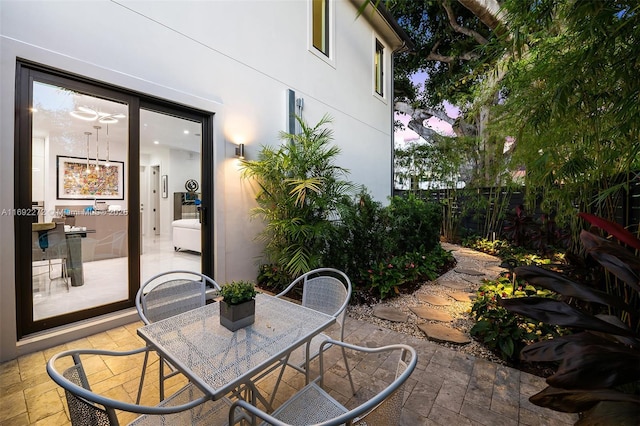 view of patio / terrace featuring fence and outdoor dining area