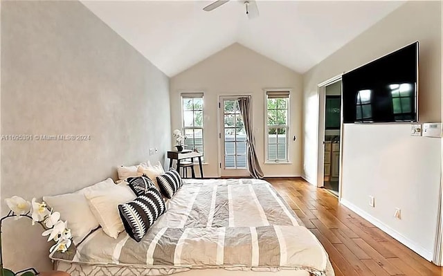 bedroom featuring hardwood / wood-style flooring, vaulted ceiling, and ceiling fan