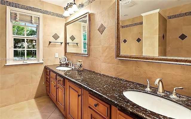 bathroom featuring tile patterned floors, vanity, and tile walls