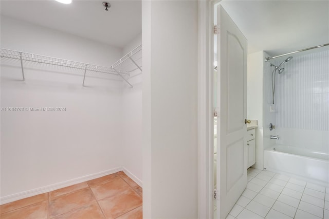 spacious closet with light tile patterned flooring