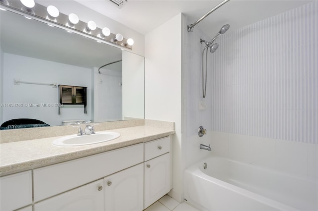 bathroom with vanity, tile patterned floors, and tiled shower / bath