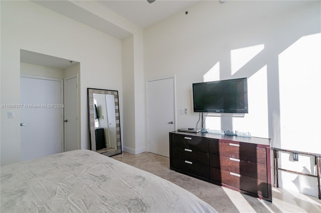 bedroom featuring a high ceiling