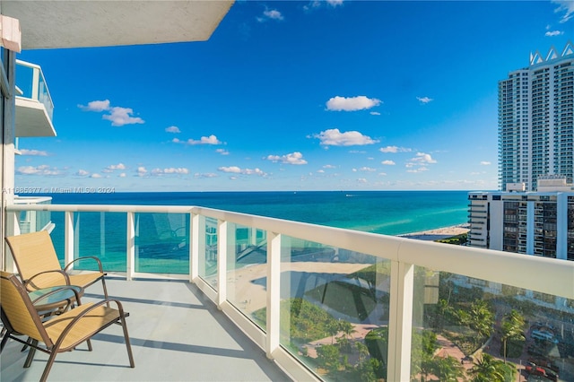 balcony featuring a water view