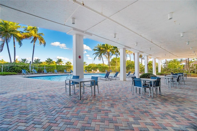 view of patio with a community pool