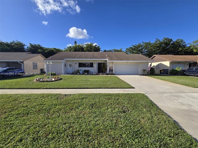 ranch-style home with a front yard and a garage