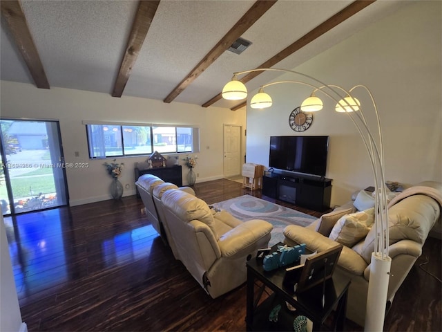 living room with dark hardwood / wood-style flooring, a textured ceiling, and vaulted ceiling with beams