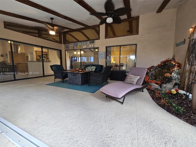 view of patio featuring an outdoor living space with a fire pit and ceiling fan