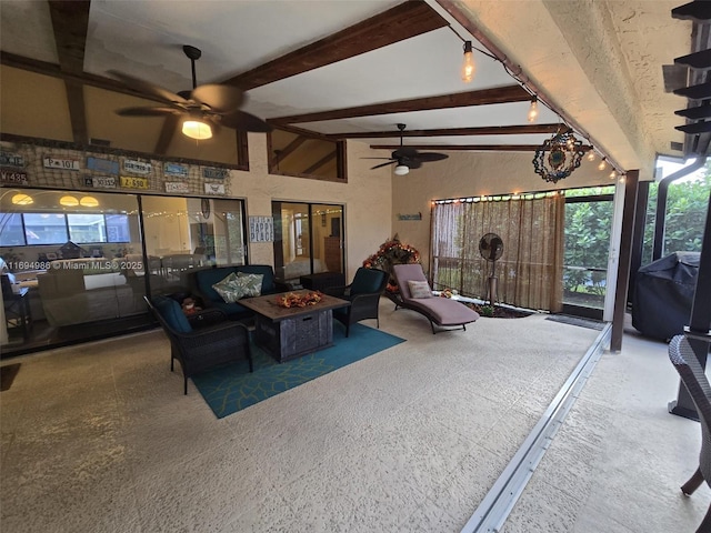 interior space with ceiling fan and an outdoor fire pit