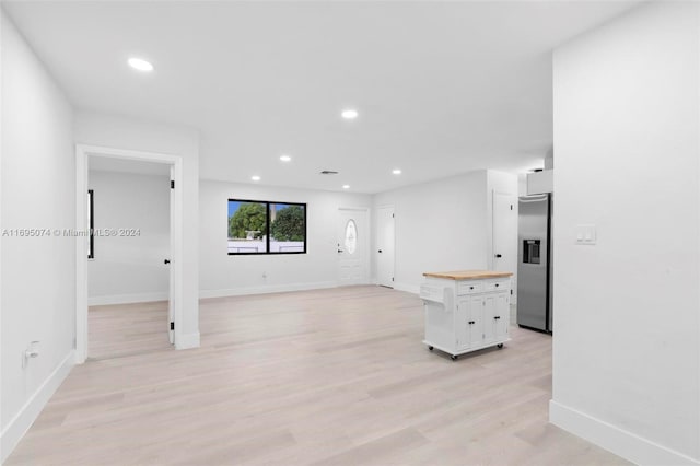 unfurnished living room with light hardwood / wood-style floors