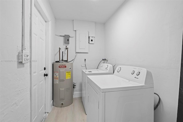 laundry room with electric panel, separate washer and dryer, light hardwood / wood-style flooring, and water heater