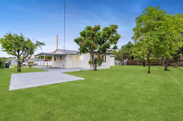 view of yard with a carport