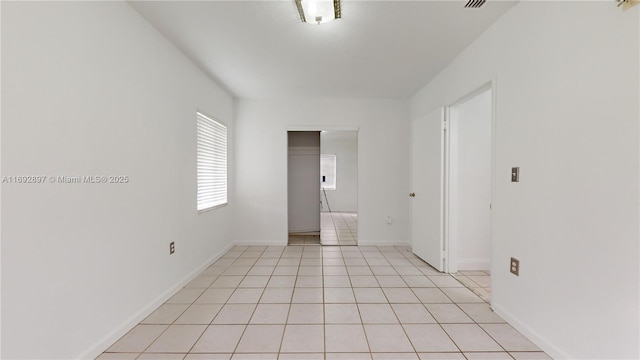 empty room with light tile patterned flooring