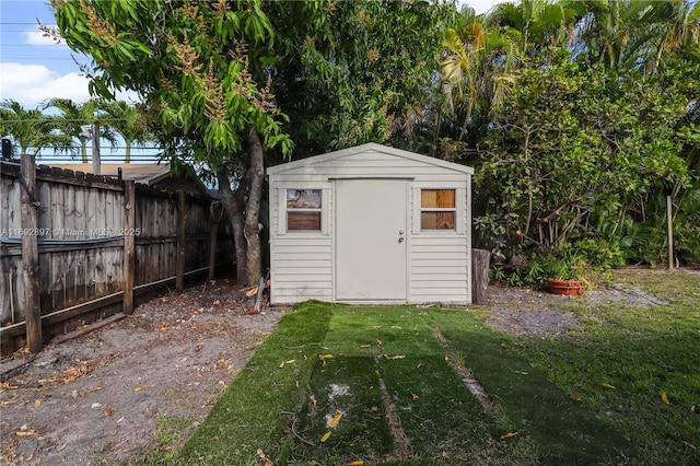 view of outbuilding with a lawn