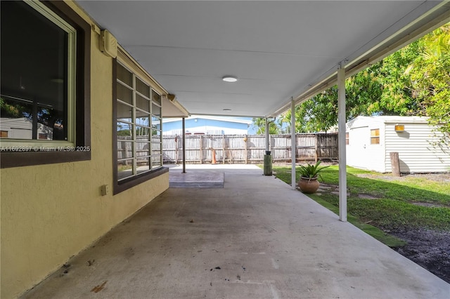 view of patio featuring a shed