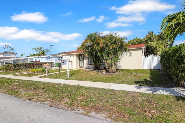 view of front of home with a front lawn