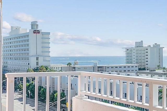 balcony featuring a water view