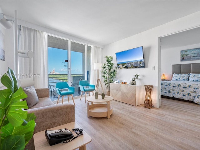 living room featuring hardwood / wood-style flooring and floor to ceiling windows