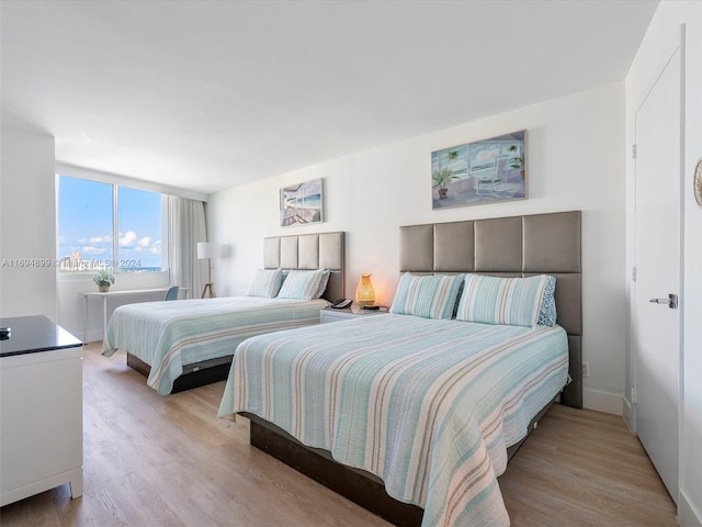 bedroom with light hardwood / wood-style floors