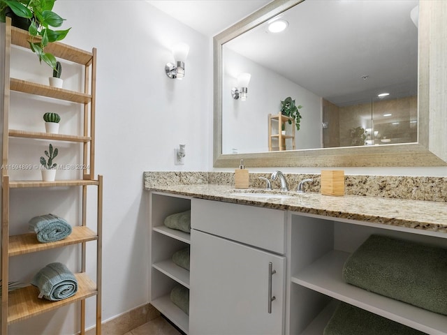 bathroom with tile patterned floors and vanity