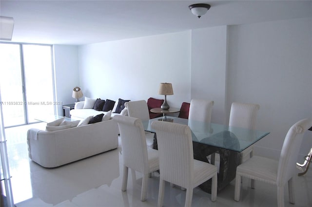 dining area featuring floor to ceiling windows