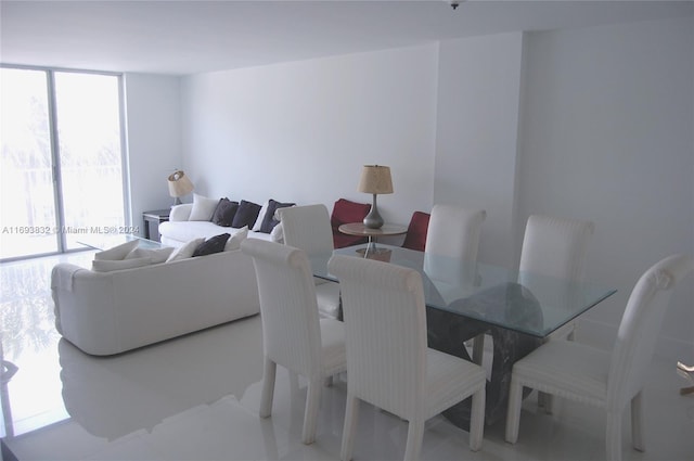 dining room featuring expansive windows and a wealth of natural light