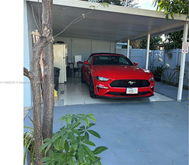 view of vehicle parking featuring a carport