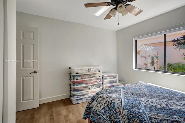 bedroom featuring ceiling fan and light hardwood / wood-style flooring