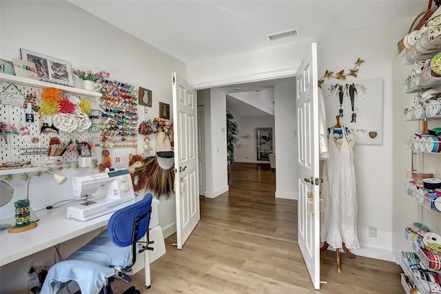 office with light hardwood / wood-style floors