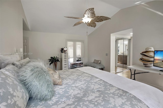 bedroom with ceiling fan, a closet, ensuite bathroom, and vaulted ceiling